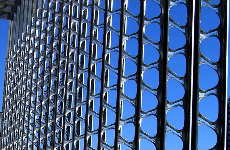 StudRite metal wall studs with open web knockouts installed on a steel-framed building under construction